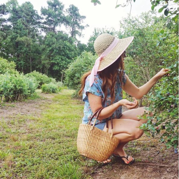 A woven straw handbag with casual outfit